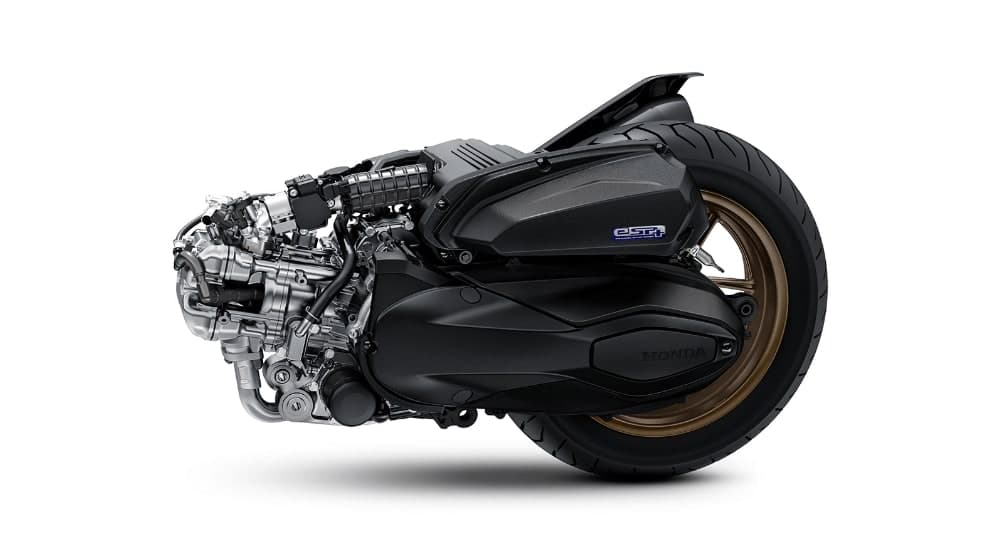 Enjin 249.5cc Honda NSS250 dengan penutup CVT dan lengan ayun belakang, lencana eSP+ kelihatan