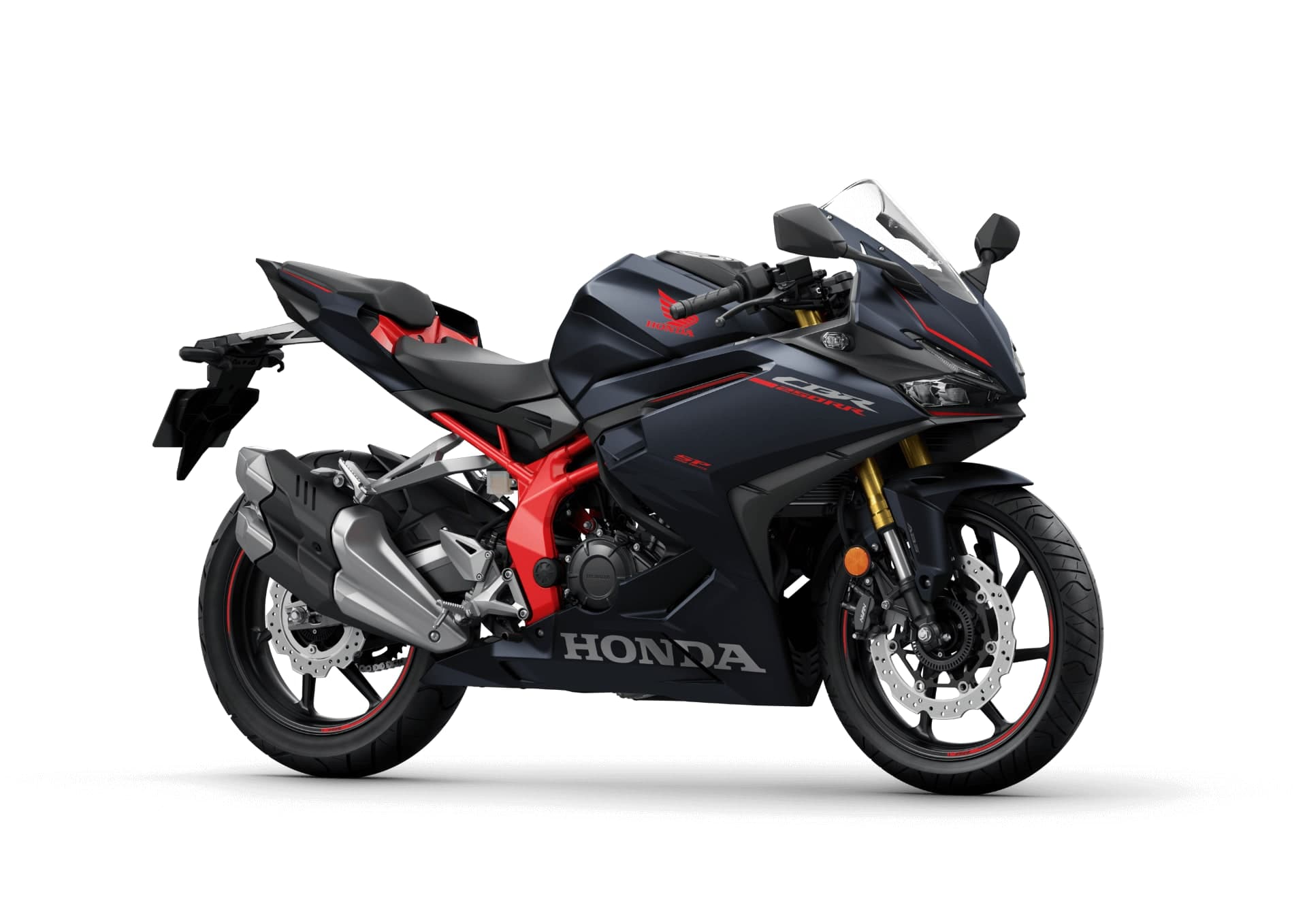 Honda CBR250RR warna biru gelap matte dengan aksen merah, pandangan tiga suku hadapan dari kiri